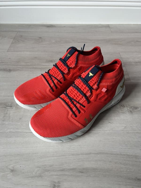 Red trainers on grey floor